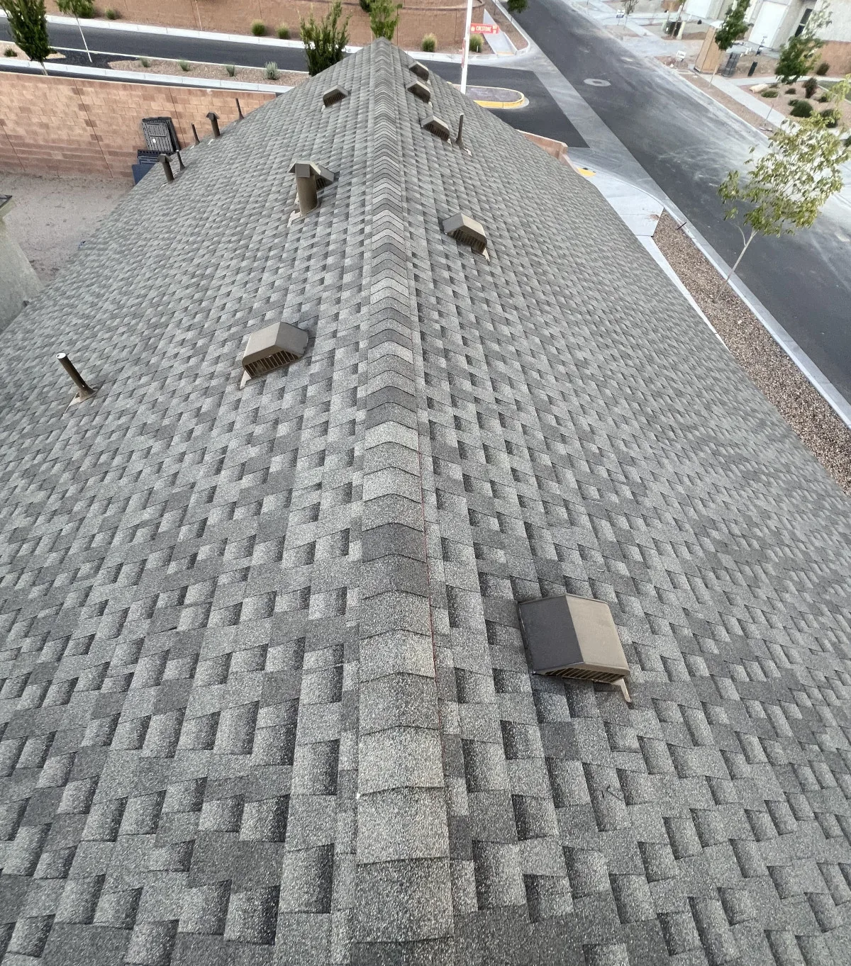 Freshly installed GAF asphalt shingle roof in an Albuquerque neighborhood